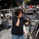 A woman reacts as she tries to find her dog in the village of Mati, near Athens.